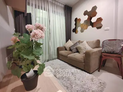 Cozy living room with plush sofa, decorative wall art, and elegant curtains