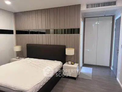 Modern bedroom with stylish headboard and sleek furniture design