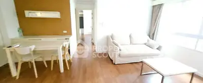 Bright and cozy living room with wooden flooring and modern furniture