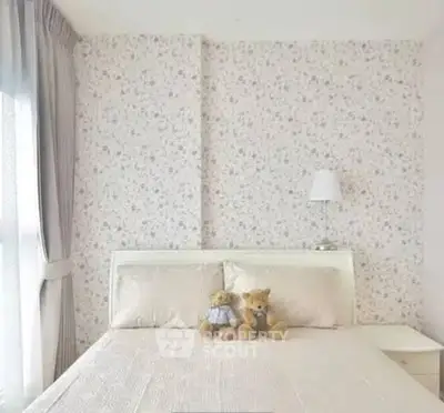 Cozy bedroom with floral wallpaper and plush teddy bears on bed