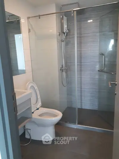 Modern bathroom with glass shower and sleek fixtures