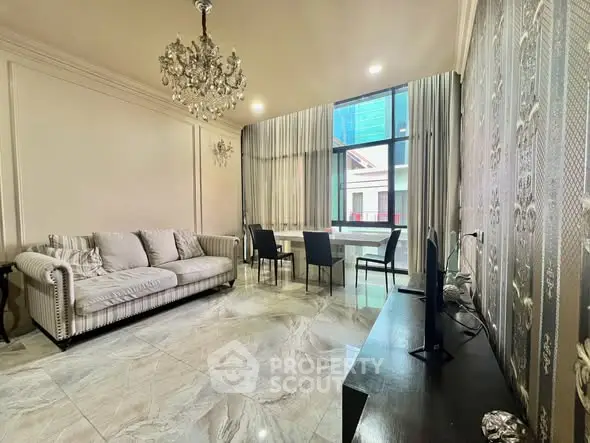 Luxurious living room with elegant chandelier and modern decor