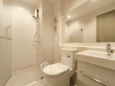 Modern bathroom with sleek fixtures and spacious shower area