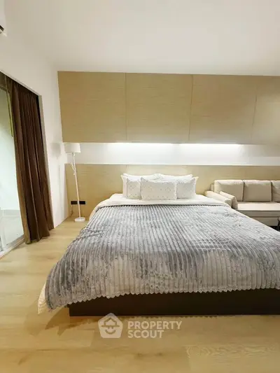 Luxurious bedroom with modern decor and cozy lighting, perfect for relaxation and comfort.