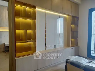 Modern living room with elegant built-in wooden cabinetry and ambient lighting