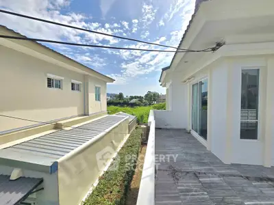 Modern residential building with spacious balcony and scenic view