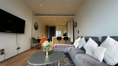 Modern living room with stylish decor and open kitchen layout in a contemporary apartment.