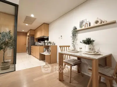 Modern dining area with wooden furniture and open kitchen layout in stylish apartment.