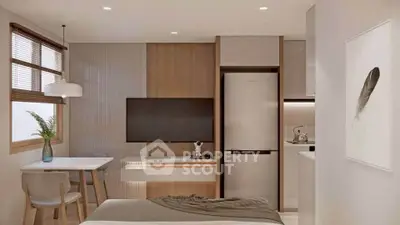 Modern studio apartment with sleek kitchen and cozy dining area, featuring a stylish interior design.
