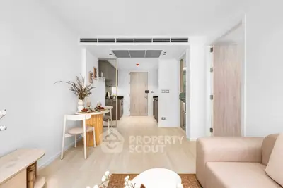 Modern open-plan living room with cozy dining area and minimalist decor