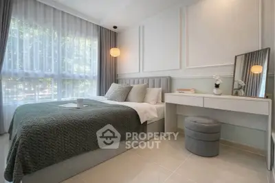 Elegant bedroom with modern decor, large window, and stylish furniture in a serene setting.