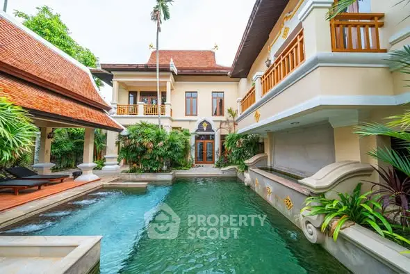 Luxurious villa with private pool and tropical garden, showcasing exquisite architecture and serene ambiance.