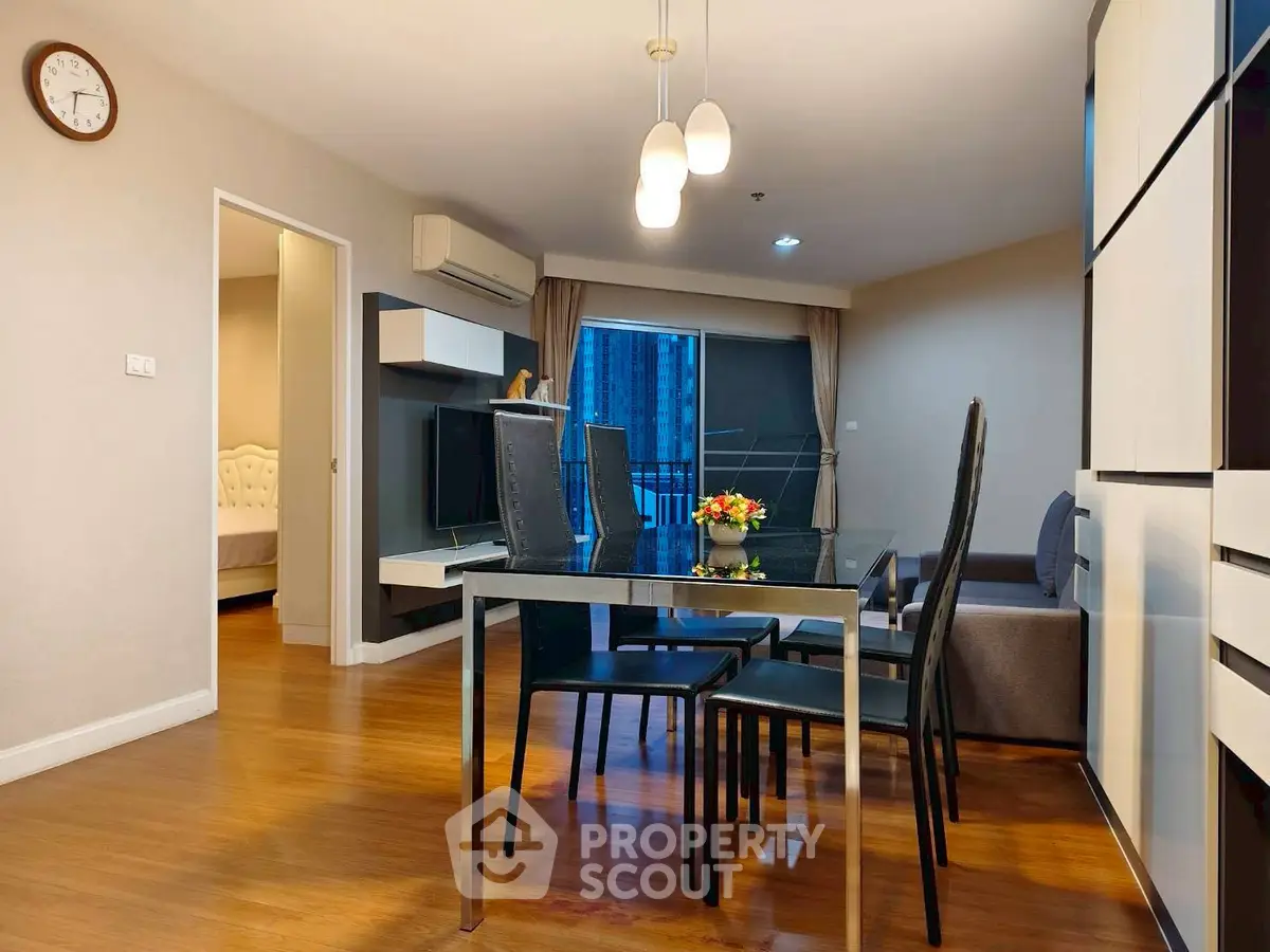 Modern living room with dining area and stylish furniture in a cozy apartment.