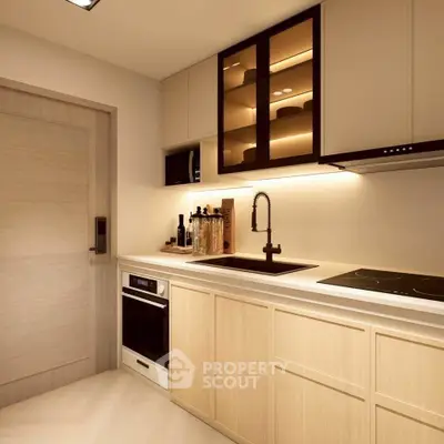 Modern kitchen with sleek cabinetry and built-in appliances