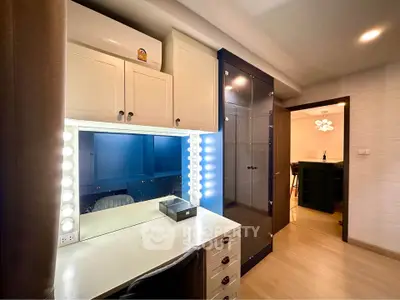 Stylish study room with modern lighting and ample storage in a contemporary apartment.