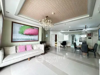 Spacious living room with elegant chandelier and modern decor in luxury apartment