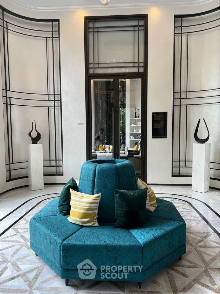 Luxurious lobby with modern decor and stylish seating in upscale building