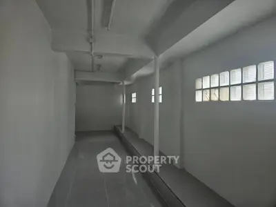Spacious storage area with natural light and tiled flooring