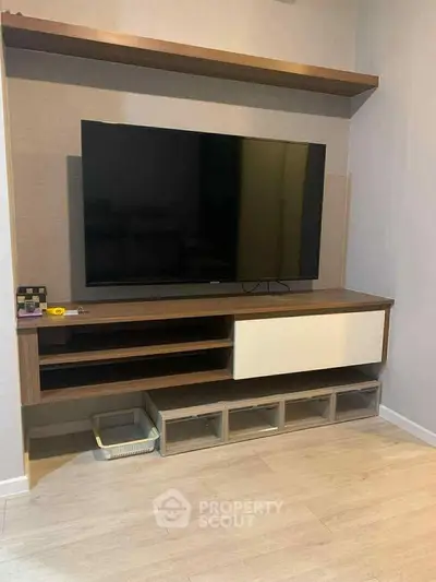 Modern living room with sleek TV unit and stylish shelving