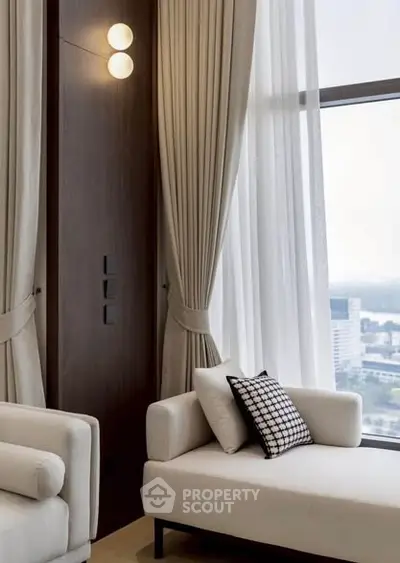 Luxurious living room with elegant decor and stunning city view through large windows.