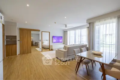 Spacious modern living room with open layout and elegant dining area