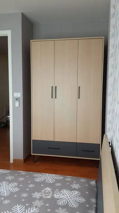 Modern bedroom with stylish wardrobe and cozy decor