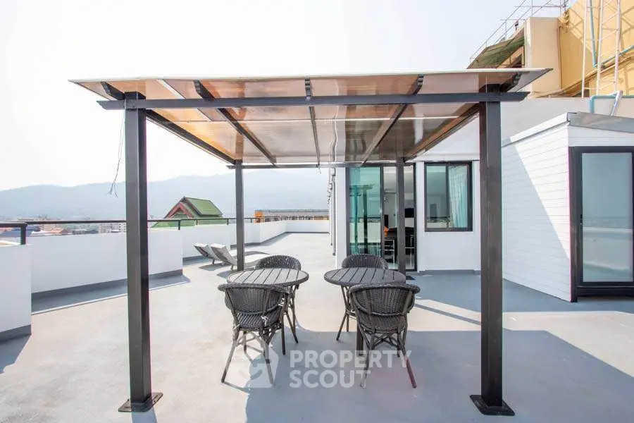 Stunning rooftop terrace with panoramic views and modern outdoor seating.