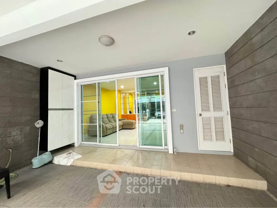 Modern interior with sliding glass doors and cozy seating area