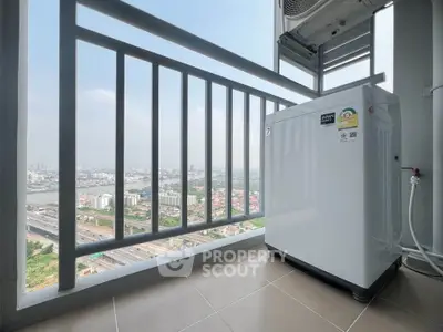 High-rise balcony with city view and compact washing machine, perfect for urban living.