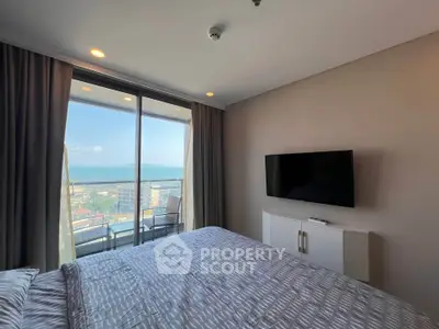 Luxurious bedroom with stunning ocean view and modern decor