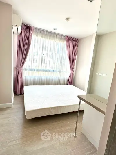 Bright bedroom with large window and modern decor in a stylish apartment