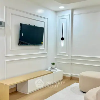 Modern living room with elegant wall paneling and minimalist decor