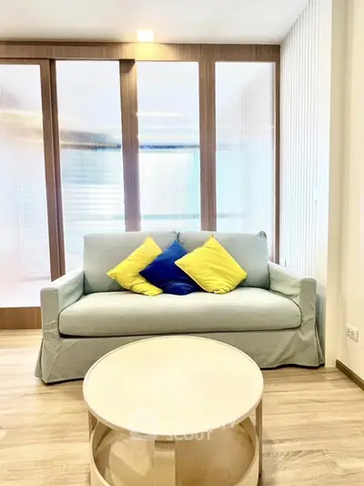 Modern living room with stylish sofa and vibrant cushions