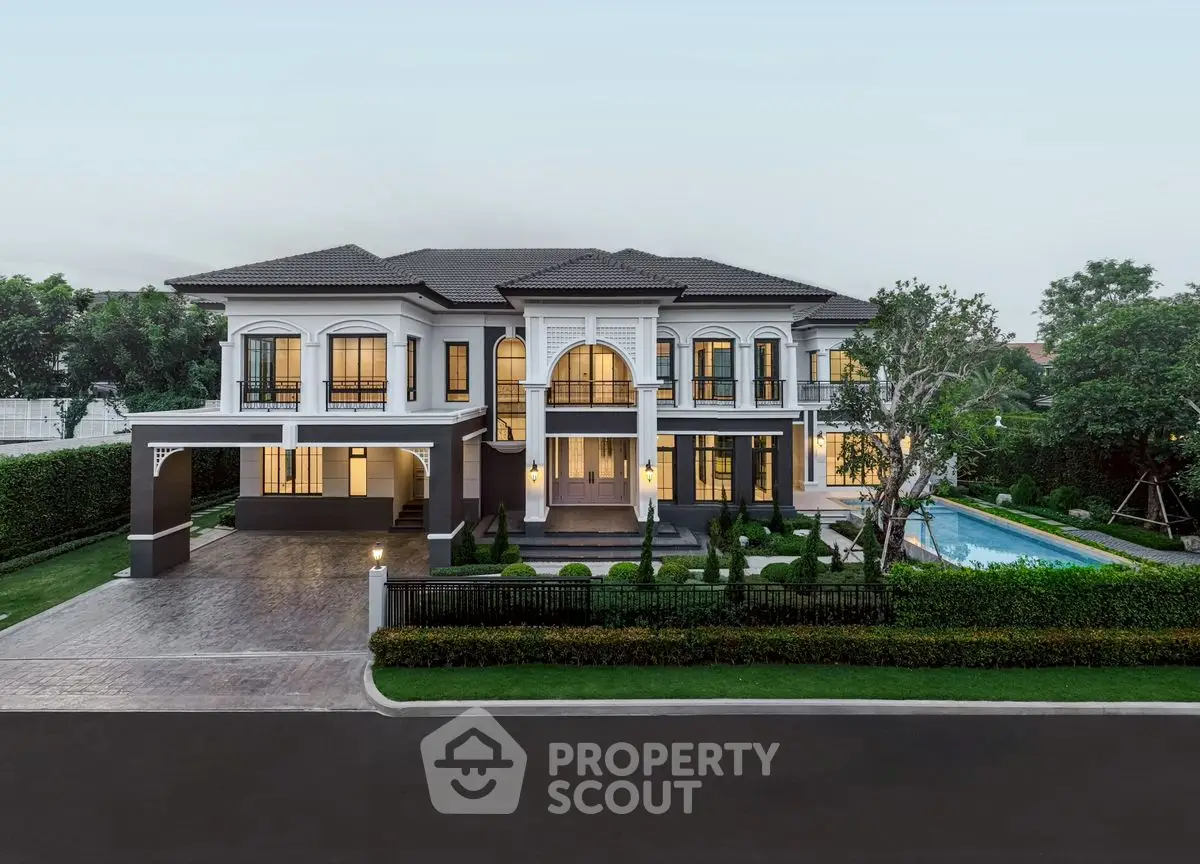 Luxurious mansion with grand entrance, manicured garden, and private pool in upscale neighborhood.