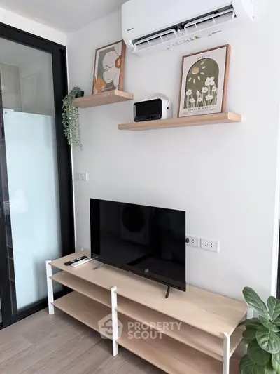 Modern living room with sleek TV setup and stylish wall shelves