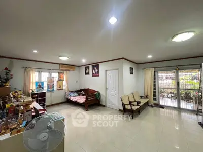 Spacious living room with cozy seating and natural light