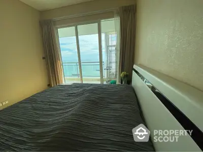 Luxurious bedroom with ocean view and private balcony access