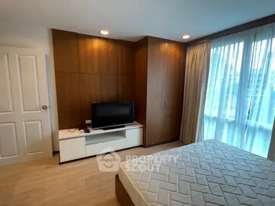 Modern bedroom with wooden accents and natural light