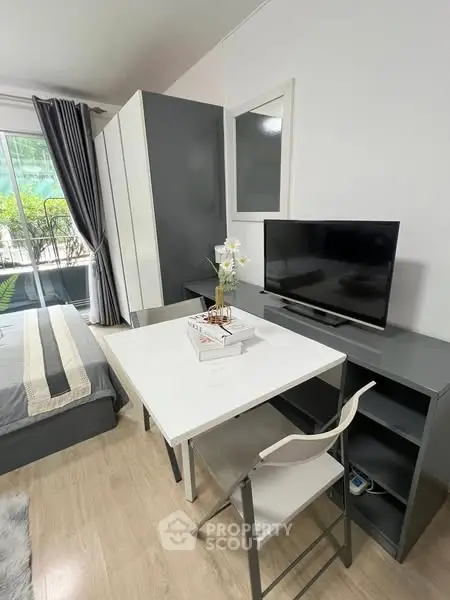 Modern studio apartment with sleek furniture and natural light