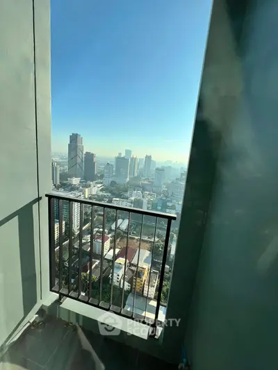 Stunning cityscape view from a high-rise balcony, perfect for urban living.