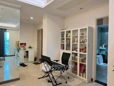 Spacious living area with modern decor and a keyboard setup, perfect for music enthusiasts.