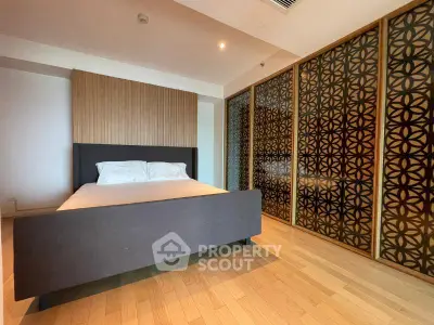 Spacious bedroom with elegant wooden accents and modern design
