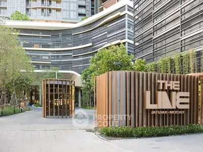 Modern architectural design of The Line Jatujak-Mochit with lush greenery and sleek facade.