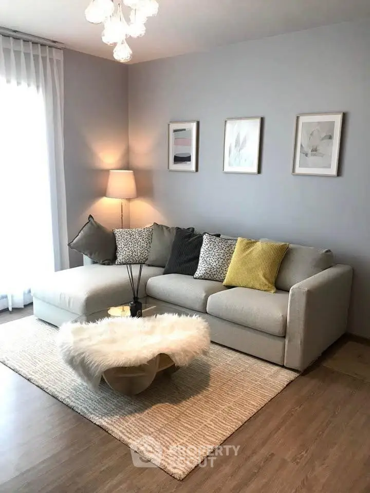 Stylish living room with cozy sectional sofa and chic decor accents.