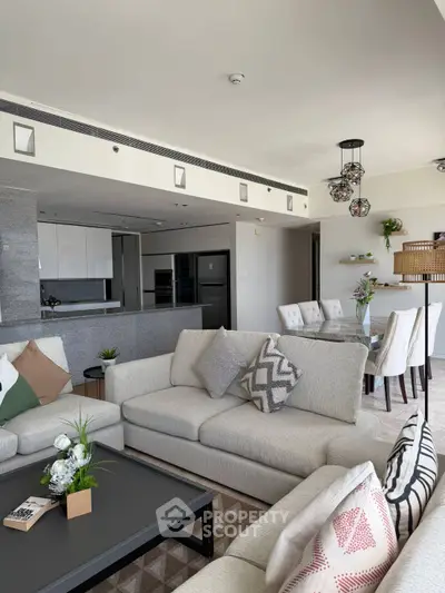 Spacious modern living room with open kitchen and elegant decor