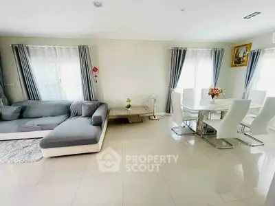 Spacious living room with modern dining area and elegant decor