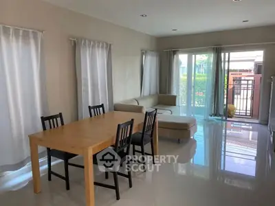 Spacious living room with modern furniture and large windows for natural light.