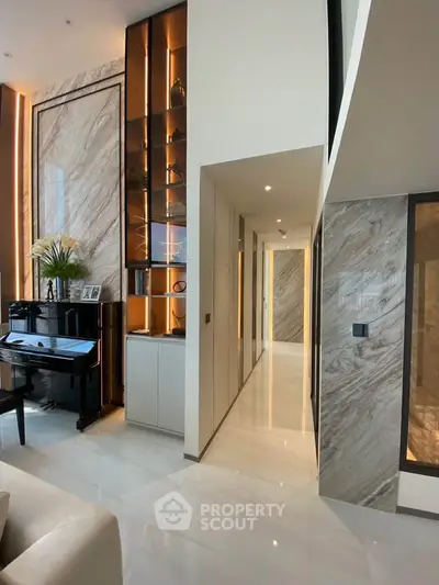Luxurious modern living room with high ceilings and elegant marble accents