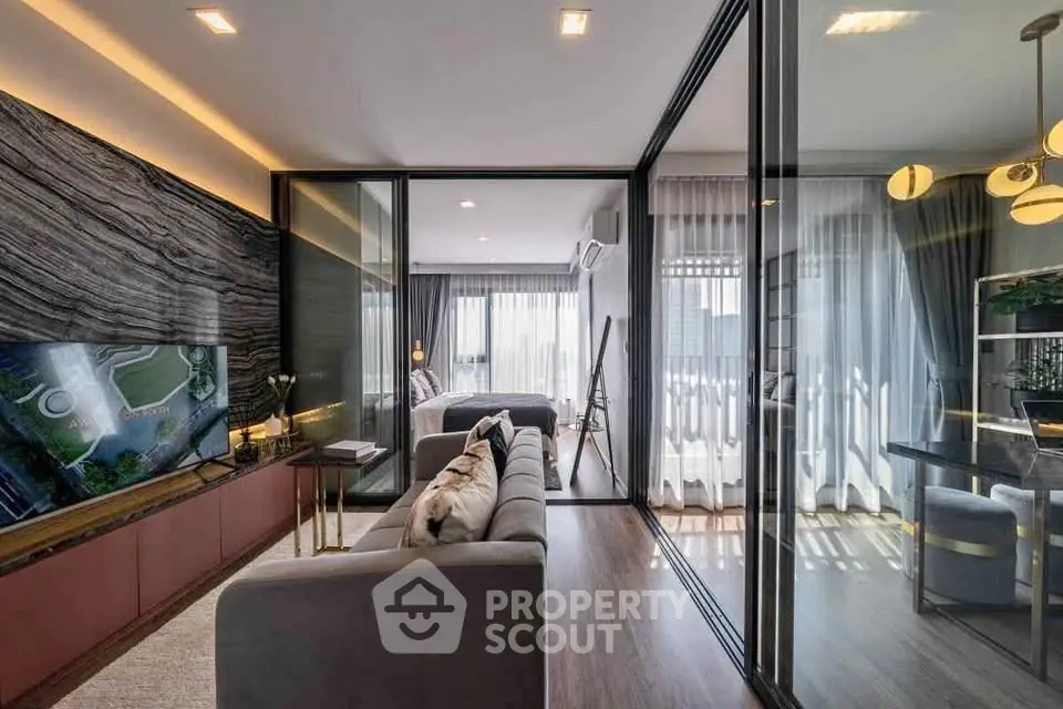 Luxurious modern living room with glass partitions and elegant decor