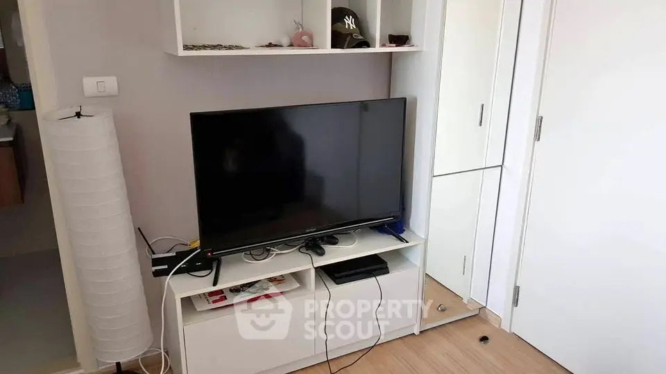 Modern living room with sleek TV setup and stylish storage solutions